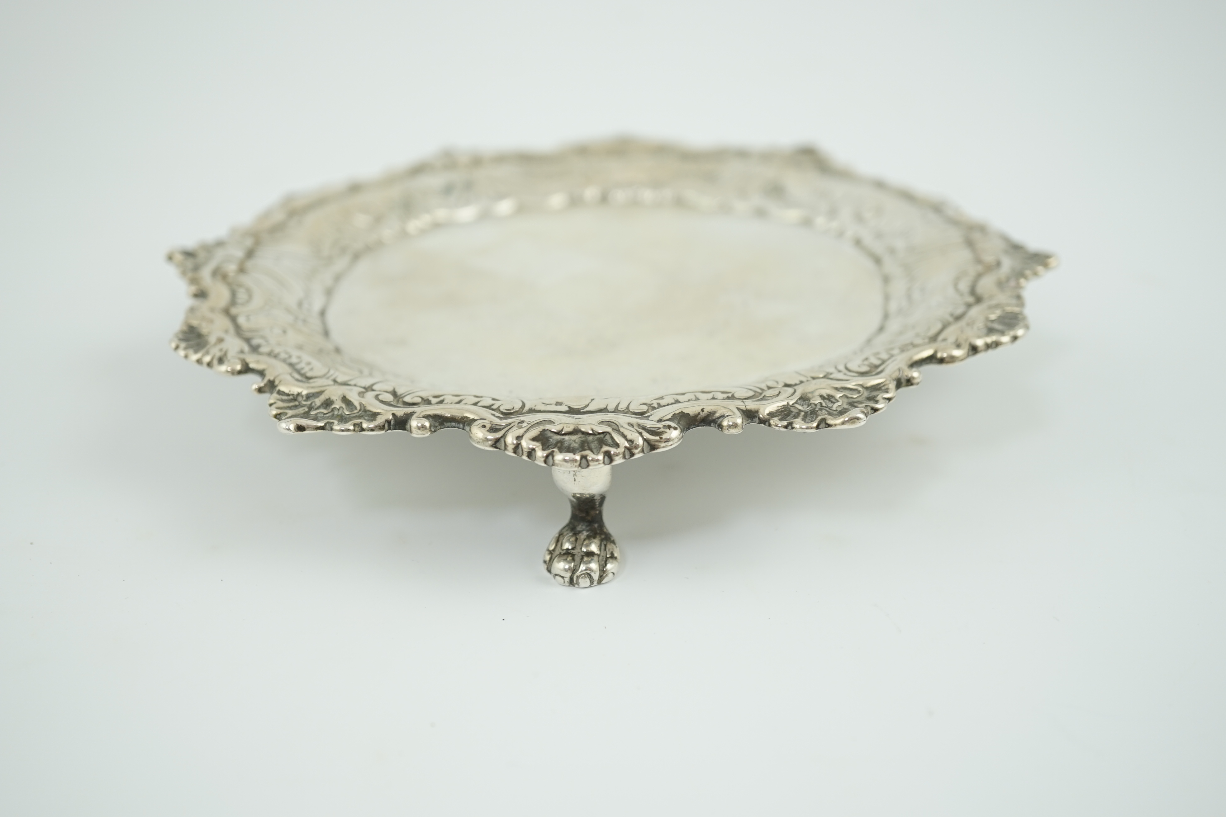 A George II silver waiter, by John Robinson II, London, 1746, with later engraved? border, on three lions paw feet